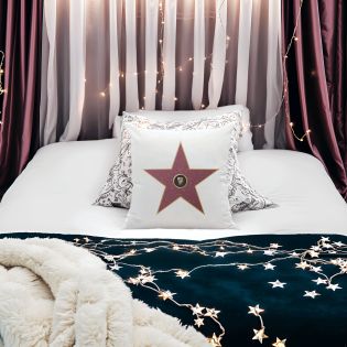 White decorative cushion personalized with first name · Interior decoration idea for cinema lovers