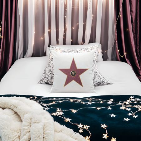 White decorative cushion personalized with first name · Interior decoration idea for cinema lovers