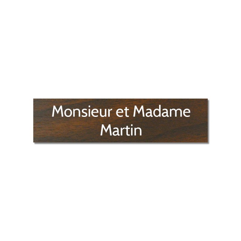 Plaque adhésive interphone ou sonnette 60 mm x 15 mm gravure personnalisée sur 2 lignes couleur effet bois foncé lettres blanche Plaque adhésive interphone ou sonnette 60 mm x 15 mm gravure personnalisée sur 2 lignes couleur effet bois foncé lettres blanche